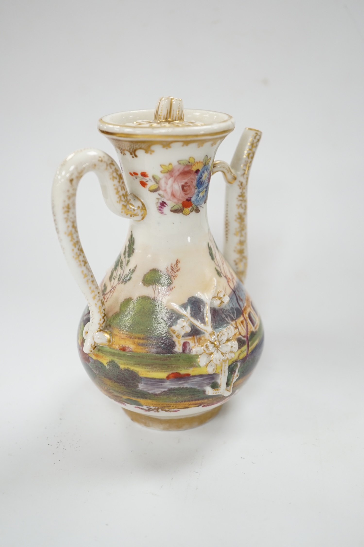 A 19th century Paris porcelain ewer and cover, hand painted with a riverscape and cattle, 13cm high. Condition - fair